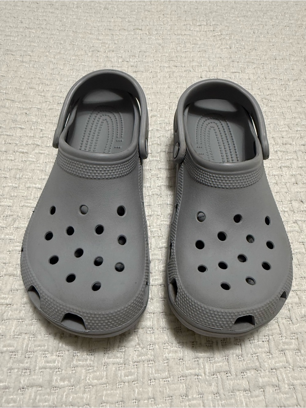 Crocs grey clogs.  Women’s size 9, men’s size 7.